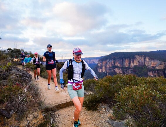 Trail runners on a ridgeline